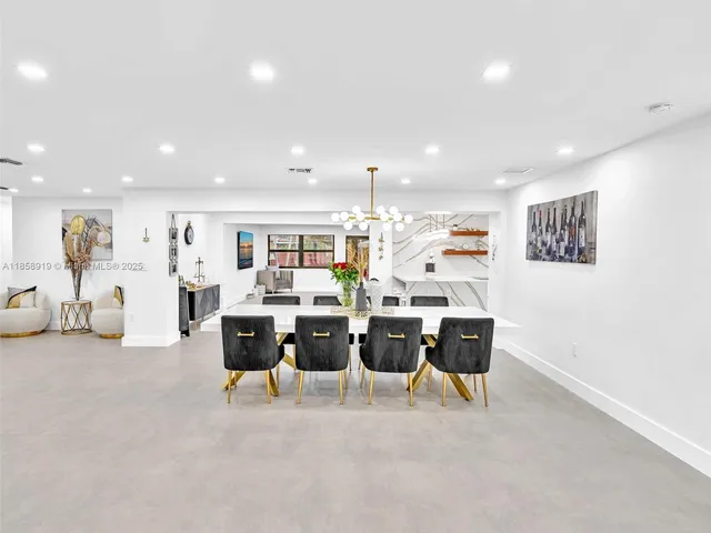 a living room with furniture and large window