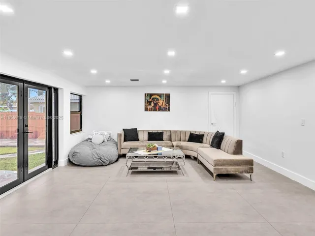 a bedroom with a bed and cabinets