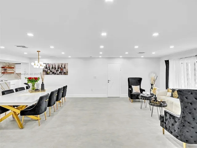 a view of kitchen and dining area with furniture