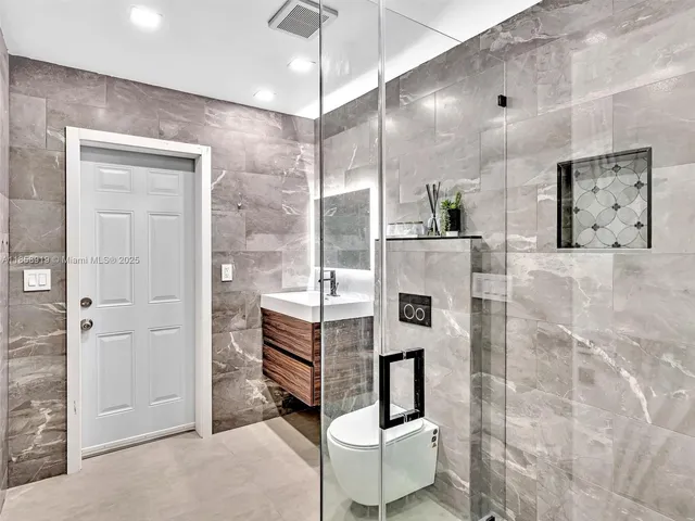 a bathroom with a sink and mirror