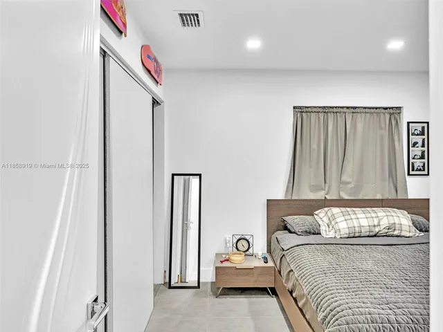 a view of swimming pool with a patio and a garden