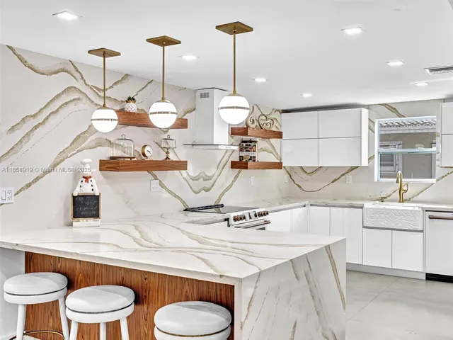 a view of living room with furniture and a chandelier