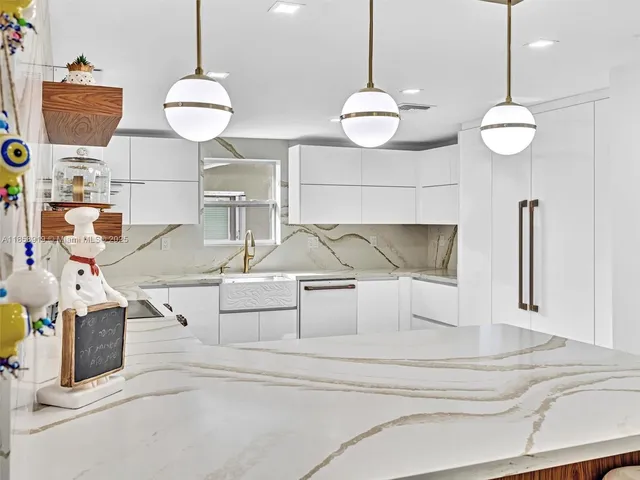 a stove top oven sitting inside of a kitchen