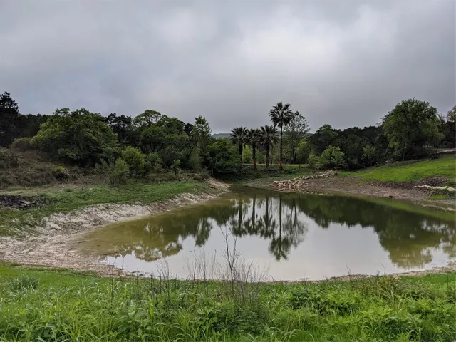 an aerial view of valley and lake