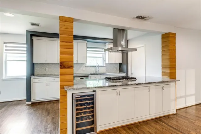 a kitchen with stainless steel appliances a stove and a refrigerator