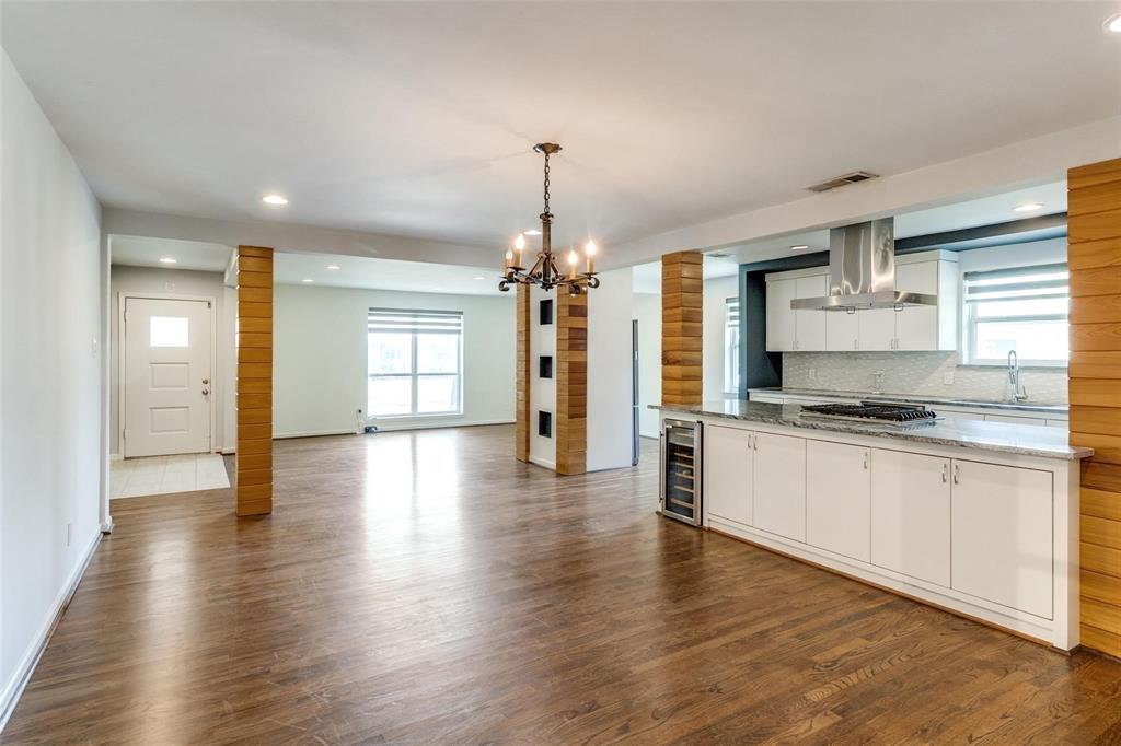 5131 Urban Crest Road Dallas, TX 75227 - Photo 13 of 25 a large kitchen with granite countertop a large counter top space and stainless steel appliances