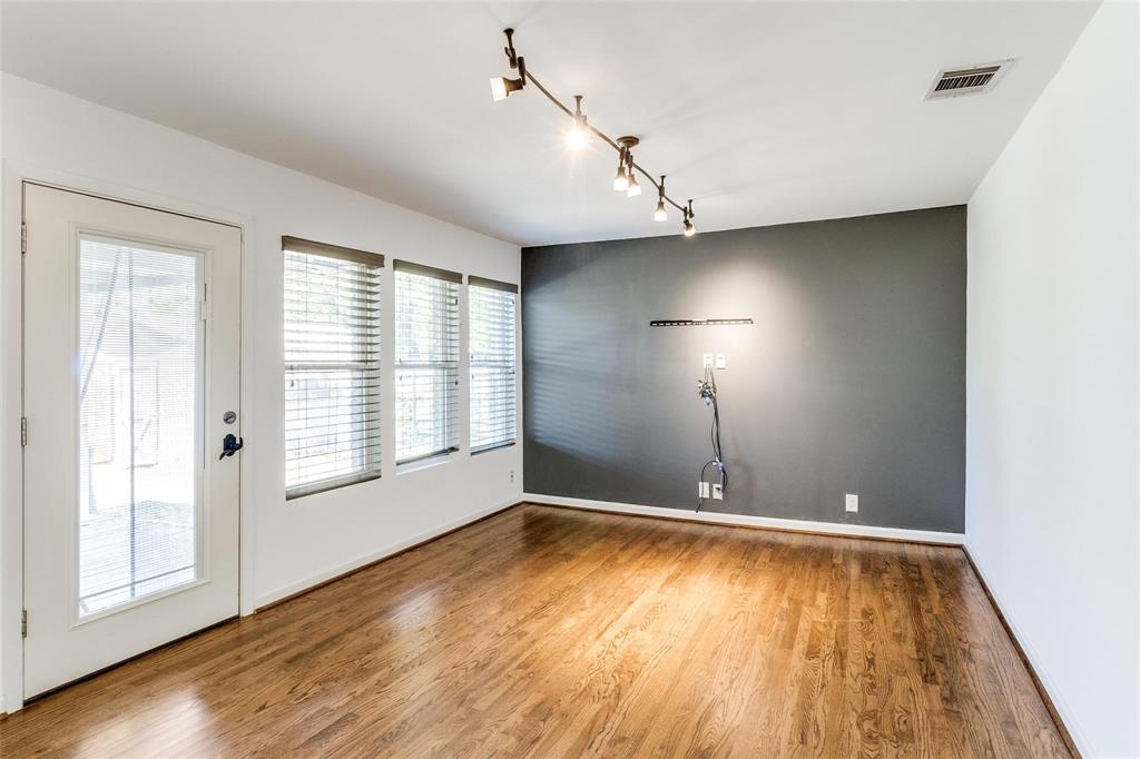 5131 Urban Crest Road Dallas, TX 75227 - Photo 15 of 25 an empty room with wooden floor and windows