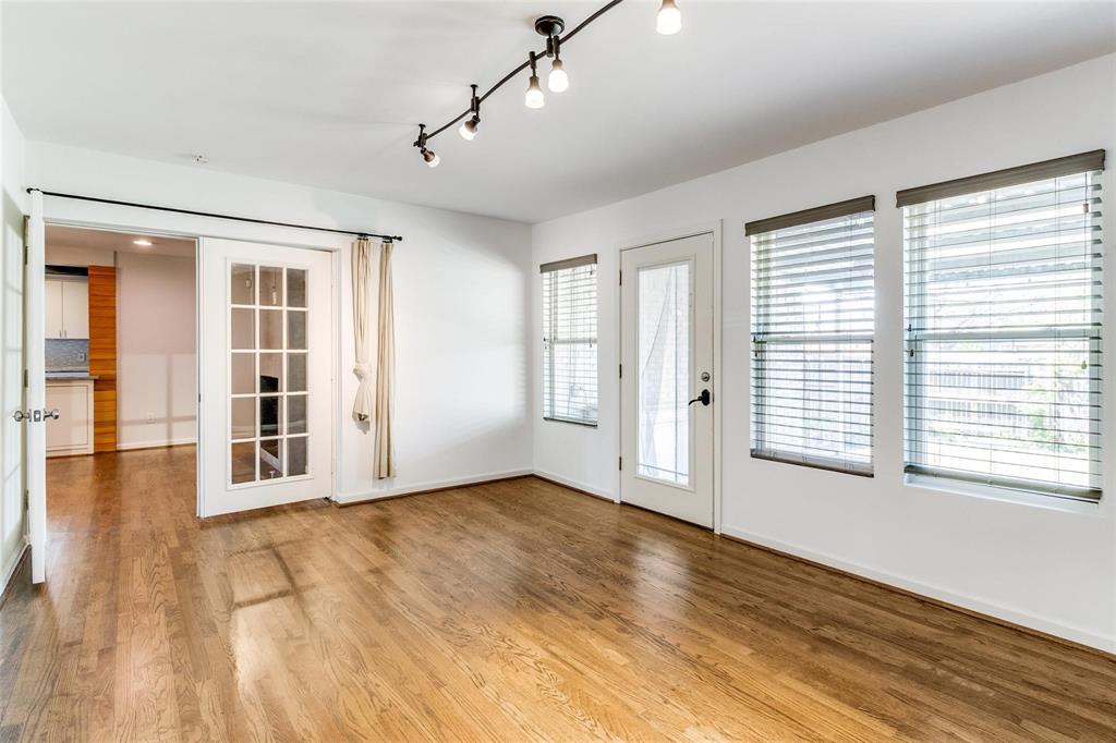 5131 Urban Crest Road Dallas, TX 75227 - Photo 16 of 25 a view of an empty room with wooden floor and a window