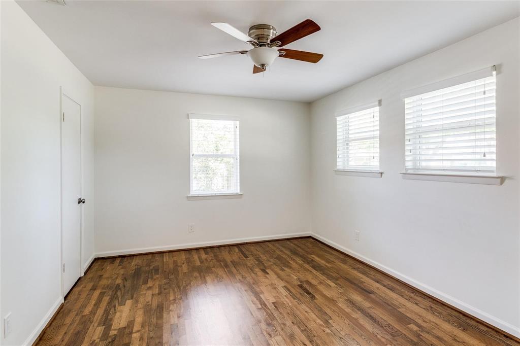 5131 Urban Crest Road Dallas, TX 75227 - Photo 18 of 25 a view of empty room with wooden floor and fan