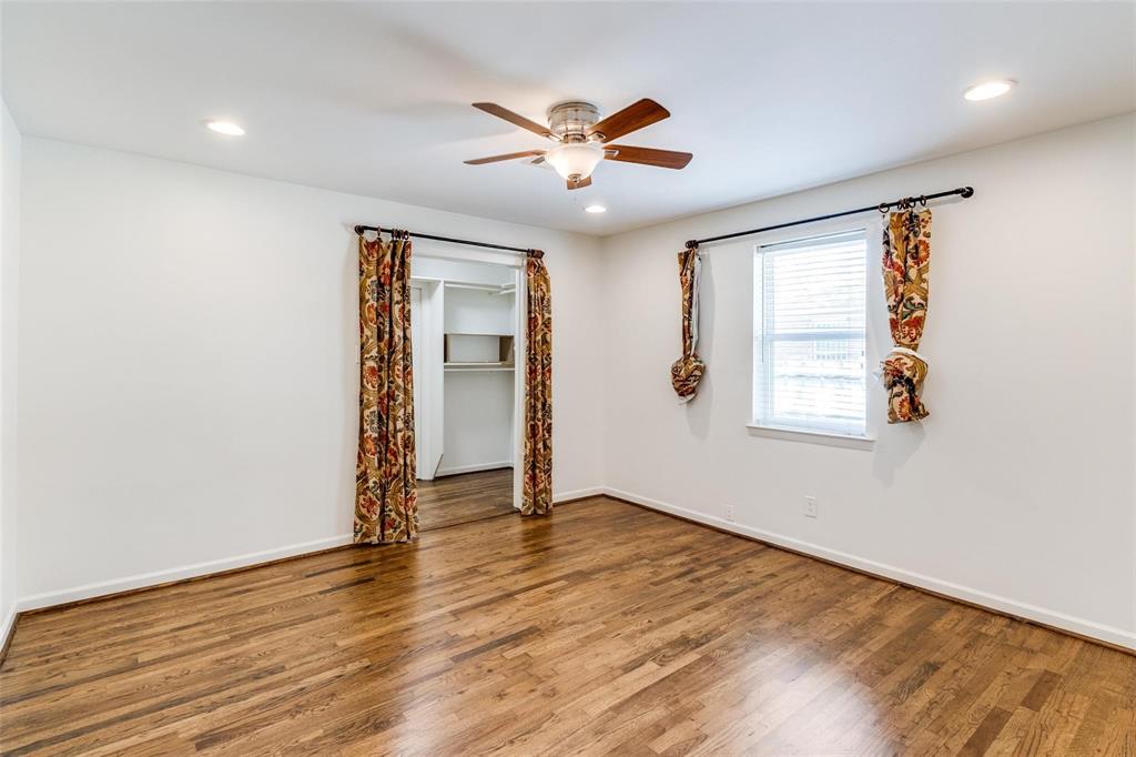 5131 Urban Crest Road Dallas, TX 75227 - Photo 19 of 25 an empty room with wooden floor and windows