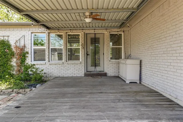 a front view of a house with a large window