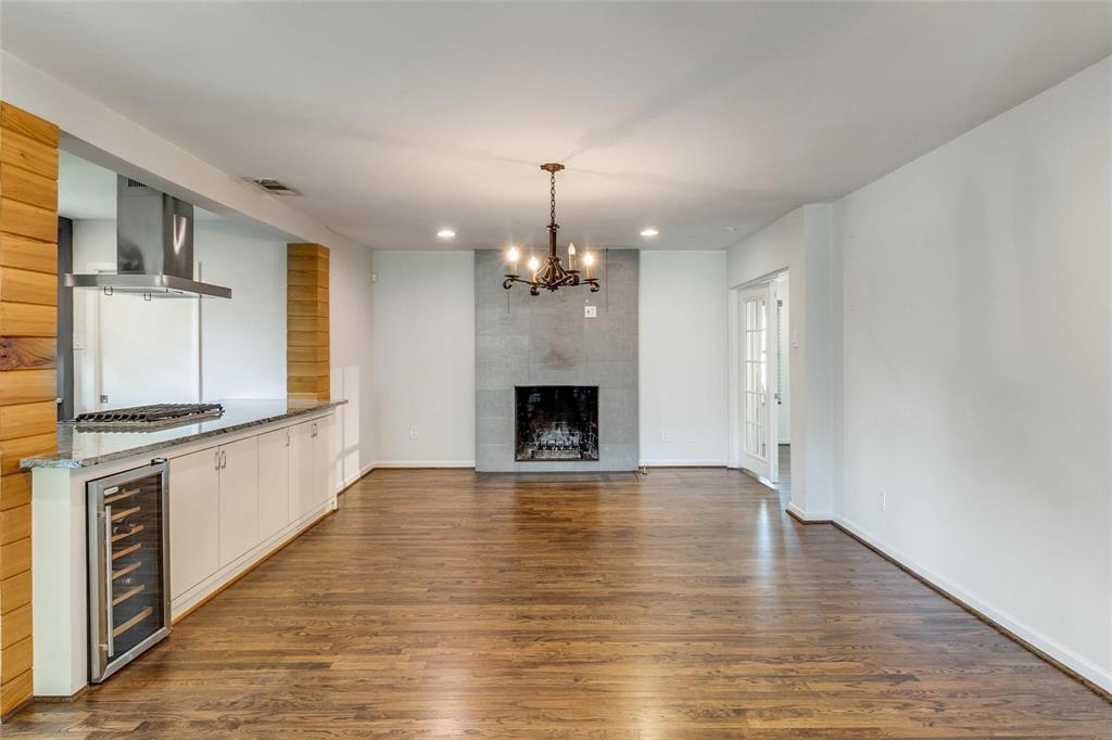 5131 Urban Crest Road Dallas, TX 75227 - Photo 5 of 25 a view of an empty room with a fireplace and a window