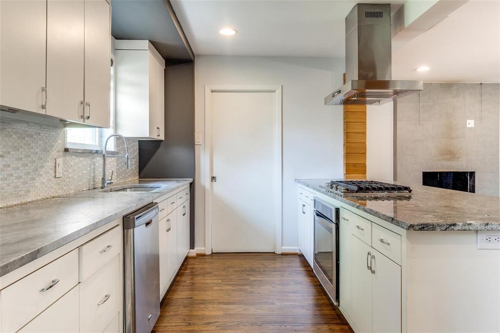 5131 Urban Crest Road Dallas, TX 75227 - Photo 9 of 25 a kitchen with stainless steel appliances granite countertop a stove and a sink