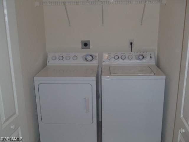 8550 Kingbird Loop Fort Myers, FL 33967 - Photo 13 of 16 a utility room with dryer and washer