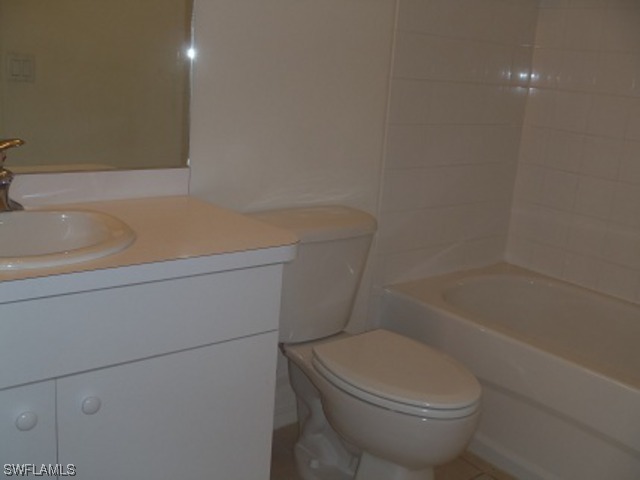 8550 Kingbird Loop Fort Myers, FL 33967 - Photo 14 of 16 a bathroom with a toilet and a bathtub