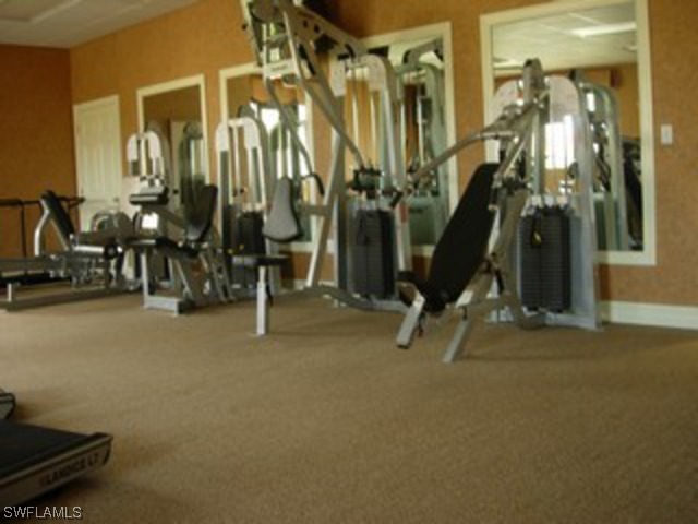 8550 Kingbird Loop Fort Myers, FL 33967 - Photo 6 of 16 a view of a room with gym equipment