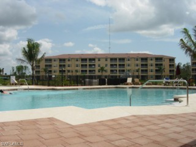 8550 Kingbird Loop Fort Myers, FL 33967 - Photo 8 of 16 a view of a swimming pool in front of a house