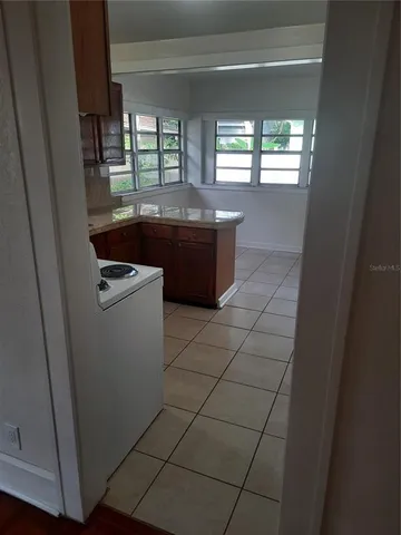 a room with washing machine and window