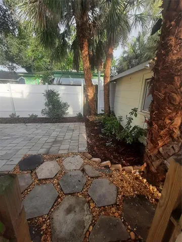 a backyard of a house with lots of green space