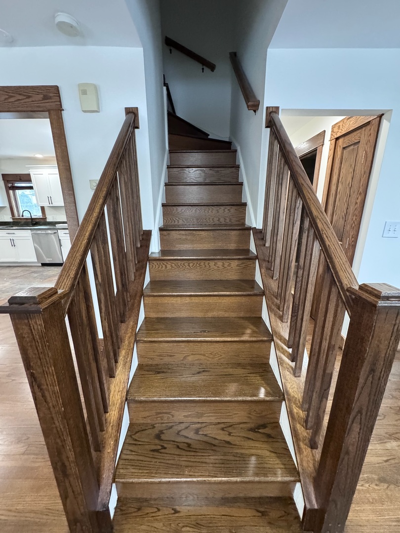 754 Spring Road Elmhurst, IL 60126 - Photo 18 of 32 a view of staircase with wooden floor and door