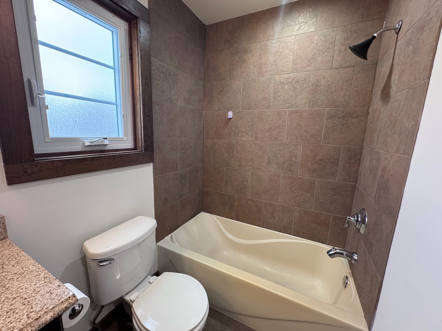 754 Spring Road Elmhurst, IL 60126 - Photo 23 of 32 a white toilet sitting next to a bathroom sink and tub
