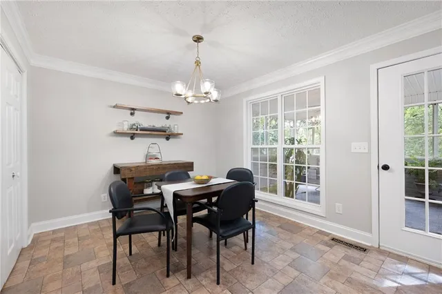 a view of a porch with chairs and backyard