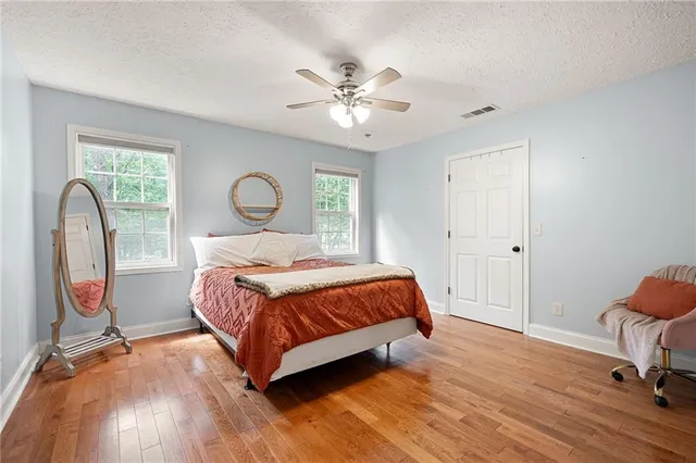 a bedroom with a bed and a television