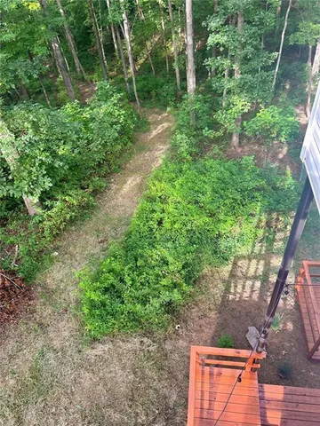 an aerial view of a houses with a yard
