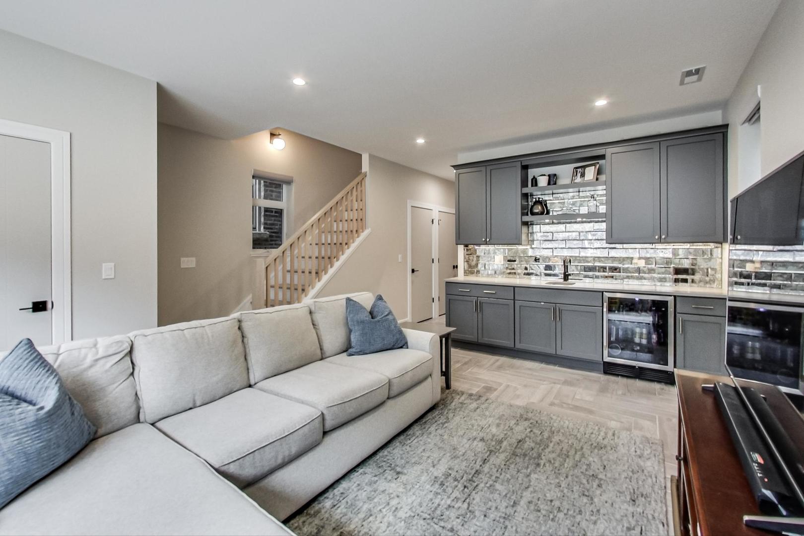 728 North Elizabeth Street, Unit 1 Chicago, IL 60642 - Photo 16 of 27 a living room with stainless steel appliances furniture and kitchen view