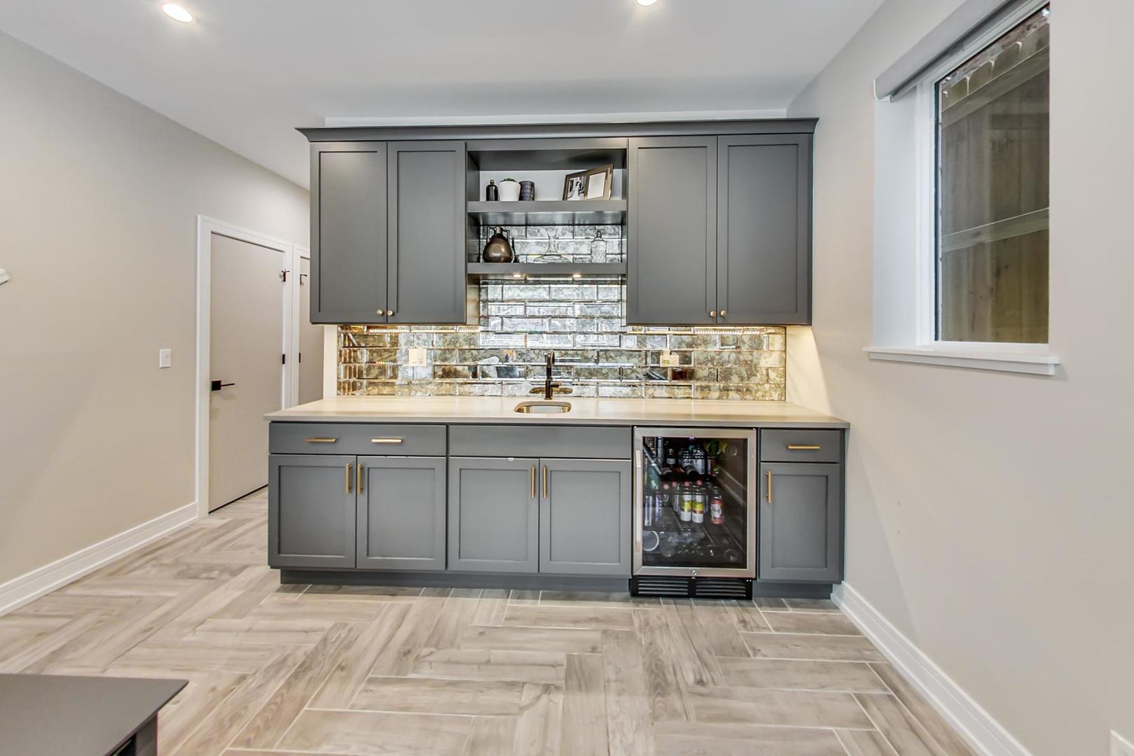 728 North Elizabeth Street, Unit 1 Chicago, IL 60642 - Photo 17 of 27 a bathroom with a sink vanity and mirror