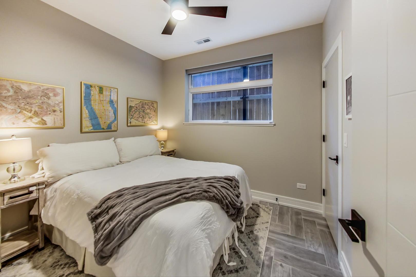 728 North Elizabeth Street, Unit 1 Chicago, IL 60642 - Photo 18 of 27 a bedroom with a bed and a window