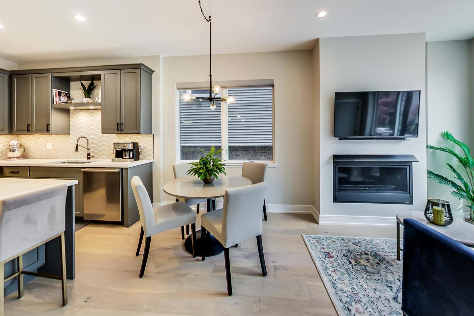 728 North Elizabeth Street, Unit 1 Chicago, IL 60642 - Photo 4 of 27 a dining room with furniture and window