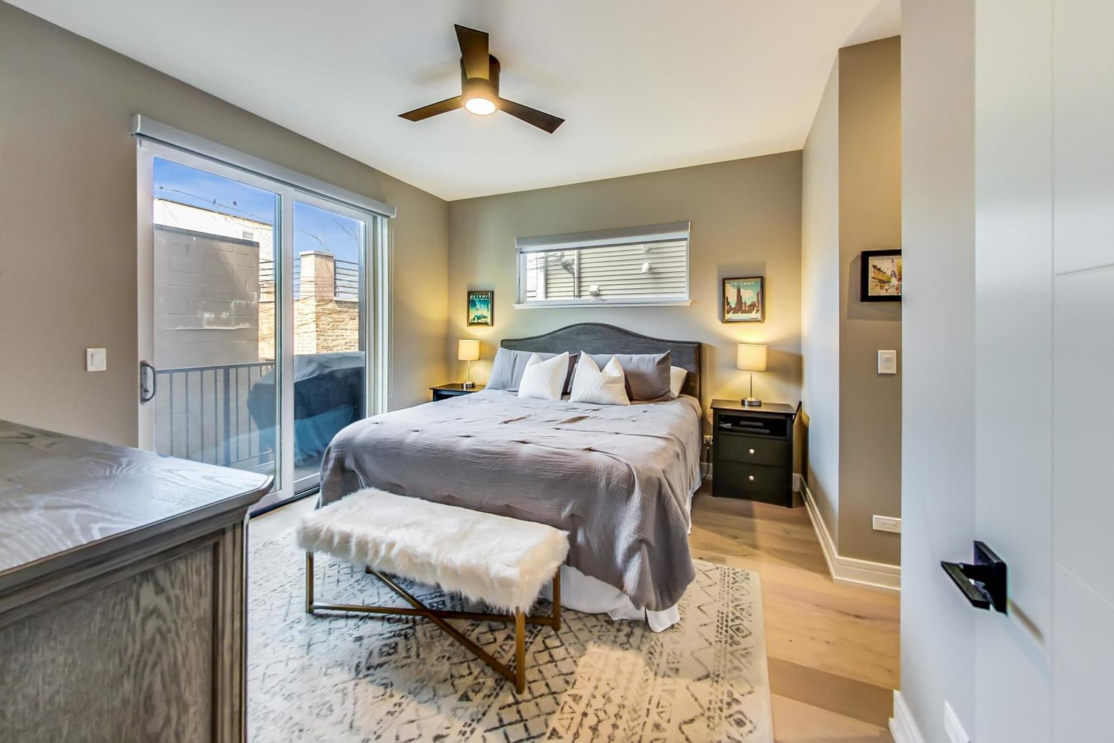 728 North Elizabeth Street, Unit 1 Chicago, IL 60642 - Photo 10 of 27 a bedroom with a bed and wooden floor