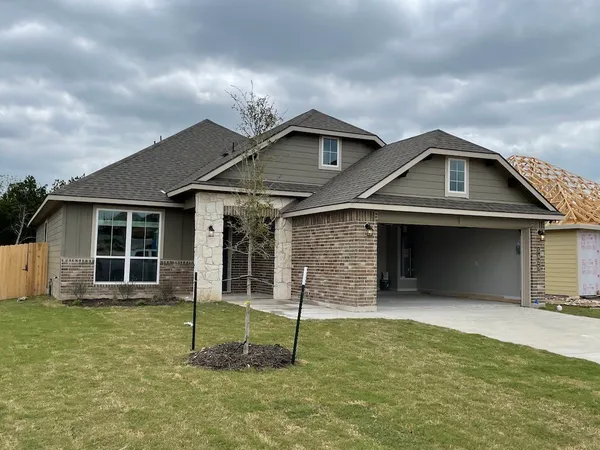 a front view of a house with a garage