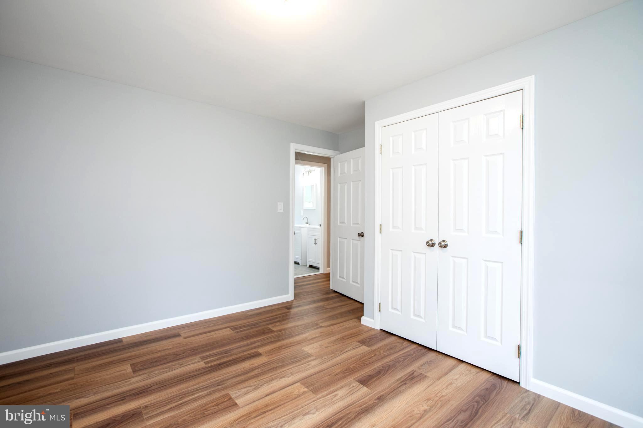5 Cold Spring Road Hamilton, NJ 08619 - Photo 11 of 33 a view of an empty room and wooden floor