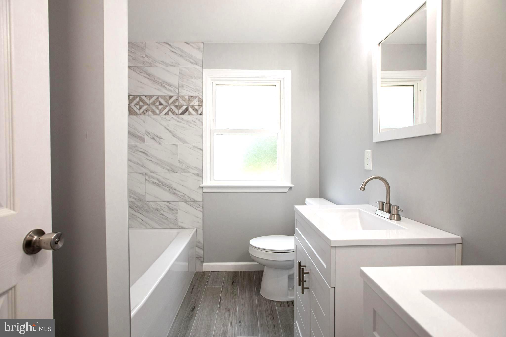 5 Cold Spring Road Hamilton, NJ 08619 - Photo 12 of 33 a bathroom with a sink toilet and shower