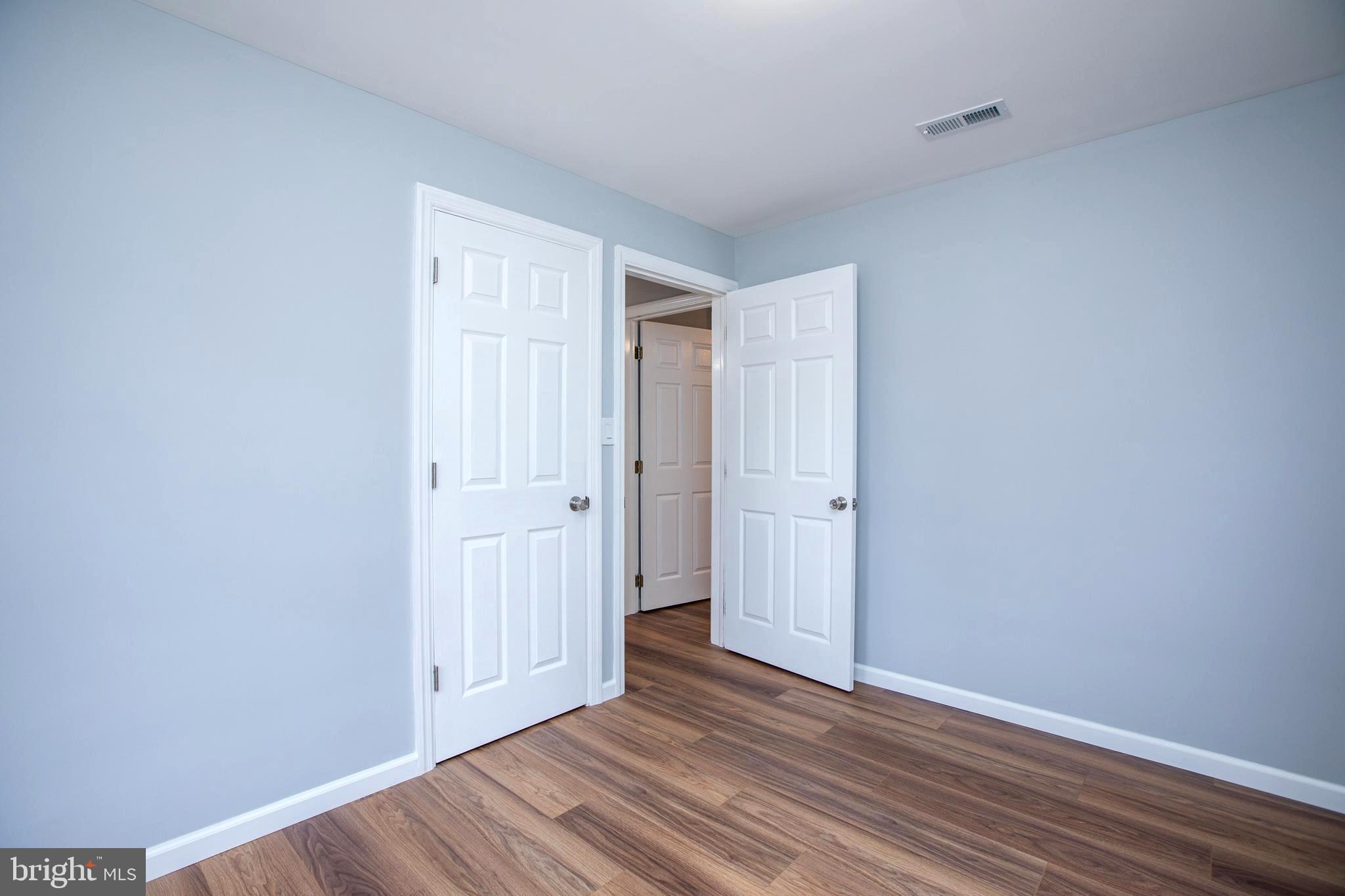 5 Cold Spring Road Hamilton, NJ 08619 - Photo 22 of 33 a view of an empty room with wooden floor