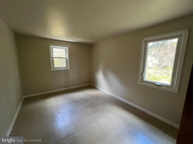 a bathroom with a toilet and a bathtub