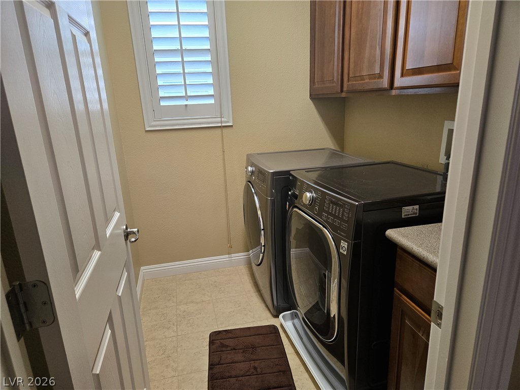 3144 Whitfeild Avenue Henderson, NV 89044 - Photo 53 of 55 Functional utility space with appliances and upper cabinetry for household tasks.