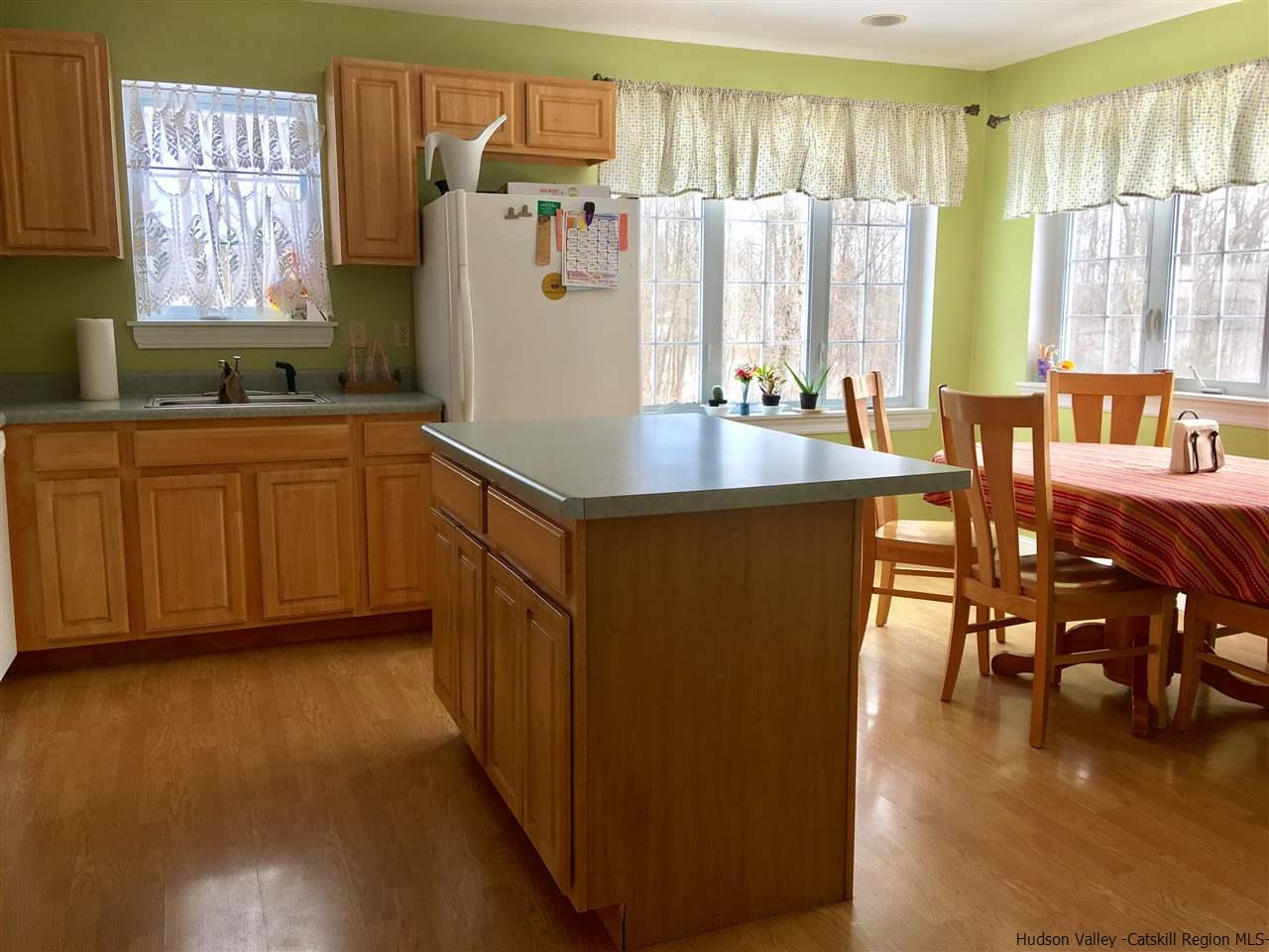 420 Forest Road Wallkill, NY 12589 - Photo 3 of 18 a kitchen with stainless steel appliances granite countertop a coffee maker a sink a counter space and a window