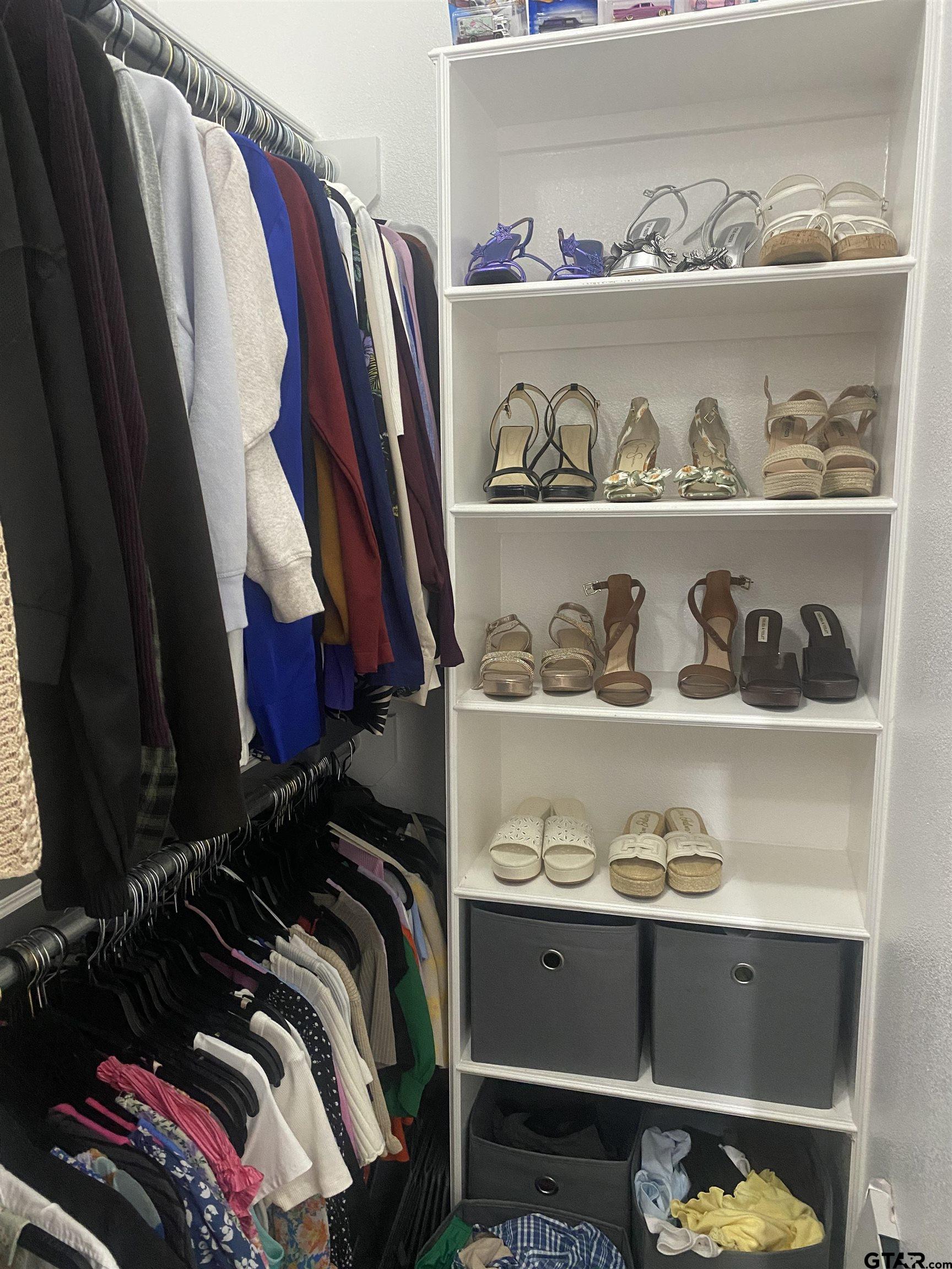 520 Cornerstone Road Lindale, TX 75771 - Photo 11 of 16 a view of walk in closet with clothes and shoes