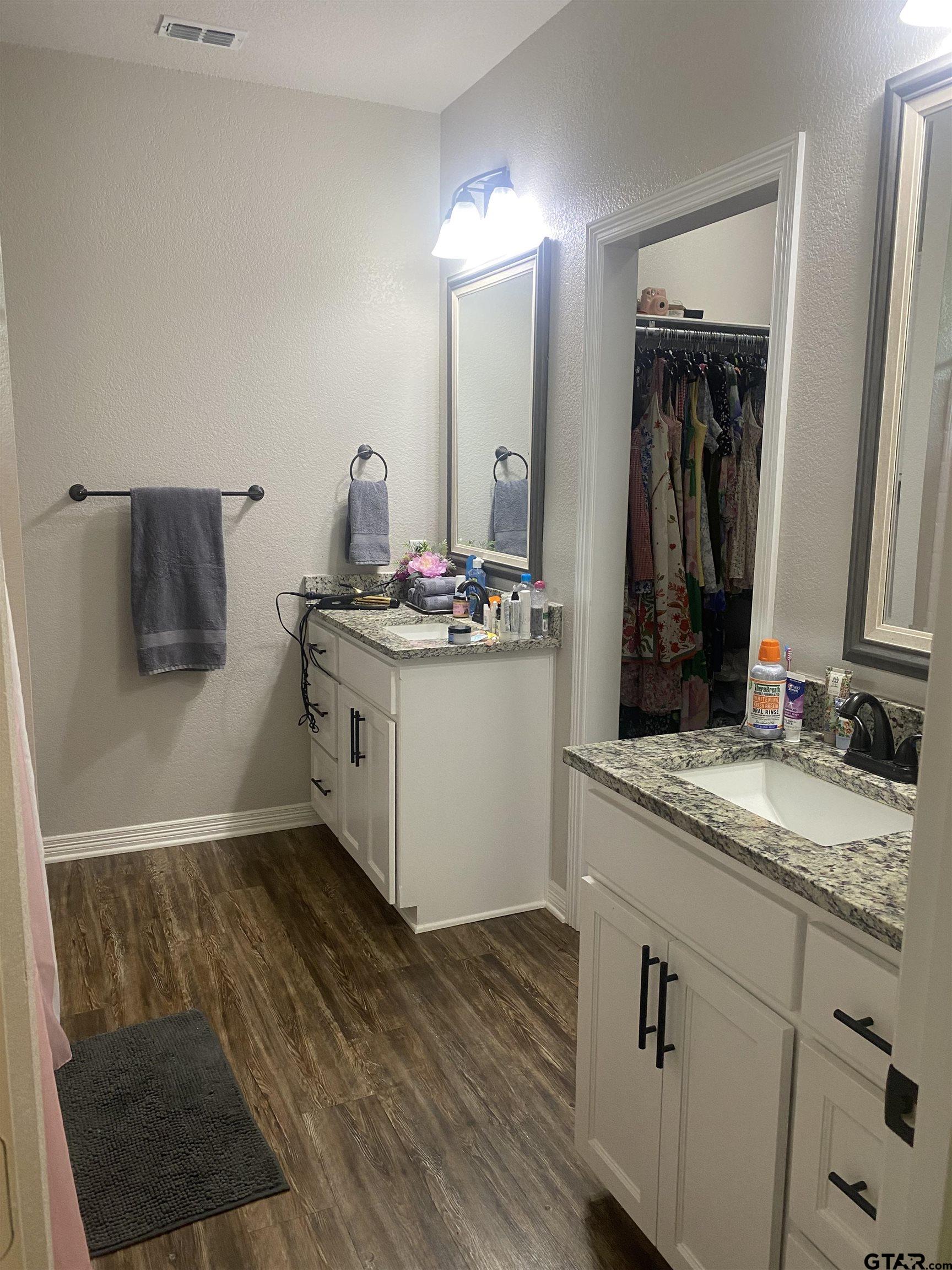 520 Cornerstone Road Lindale, TX 75771 - Photo 12 of 16 a bathroom with a sink and a mirror