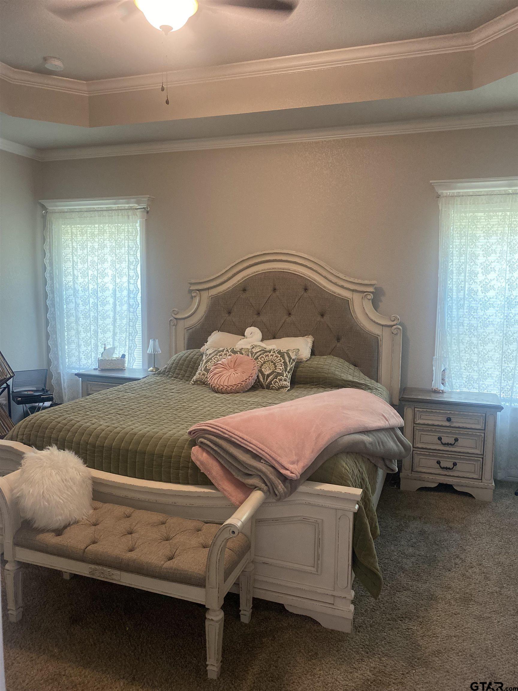 520 Cornerstone Road Lindale, TX 75771 - Photo 7 of 16 a bedroom with a bed and windows