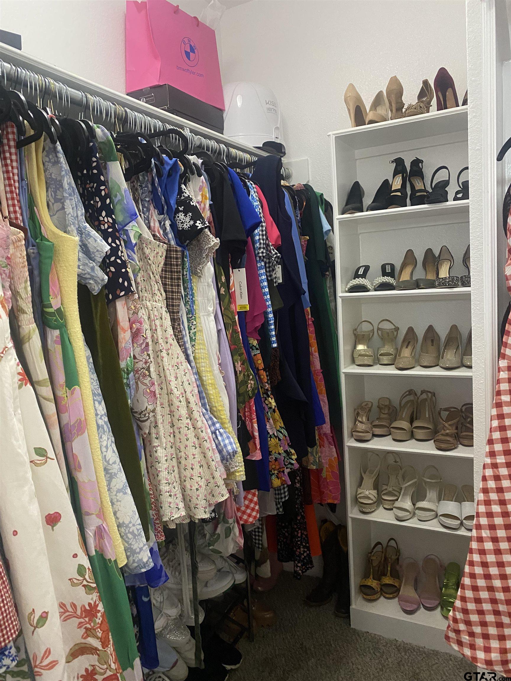 520 Cornerstone Road Lindale, TX 75771 - Photo 10 of 16 a view of walk in closet with clothes and shoes