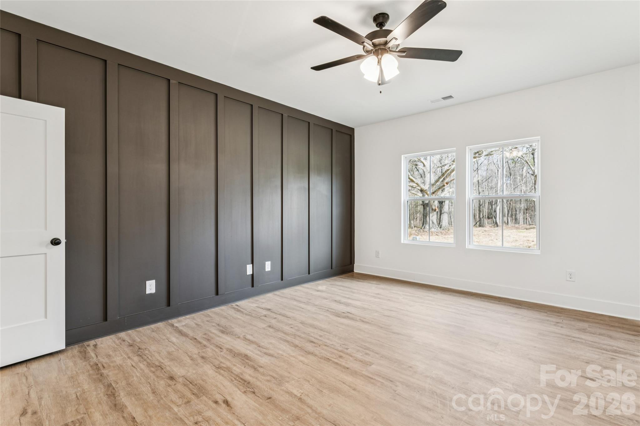 6115 Morehead Road Harrisburg, NC 28075 - Photo 21 of 38 a view of a livingroom with a window and a ceiling fan