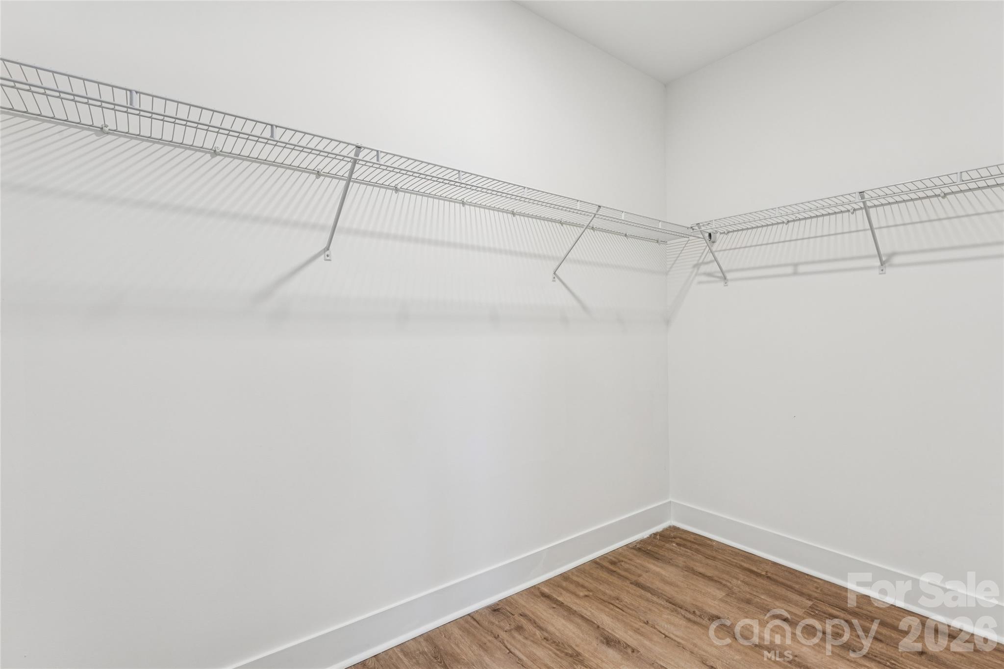 6115 Morehead Road Harrisburg, NC 28075 - Photo 23 of 38 a view of a room with racks on the wall