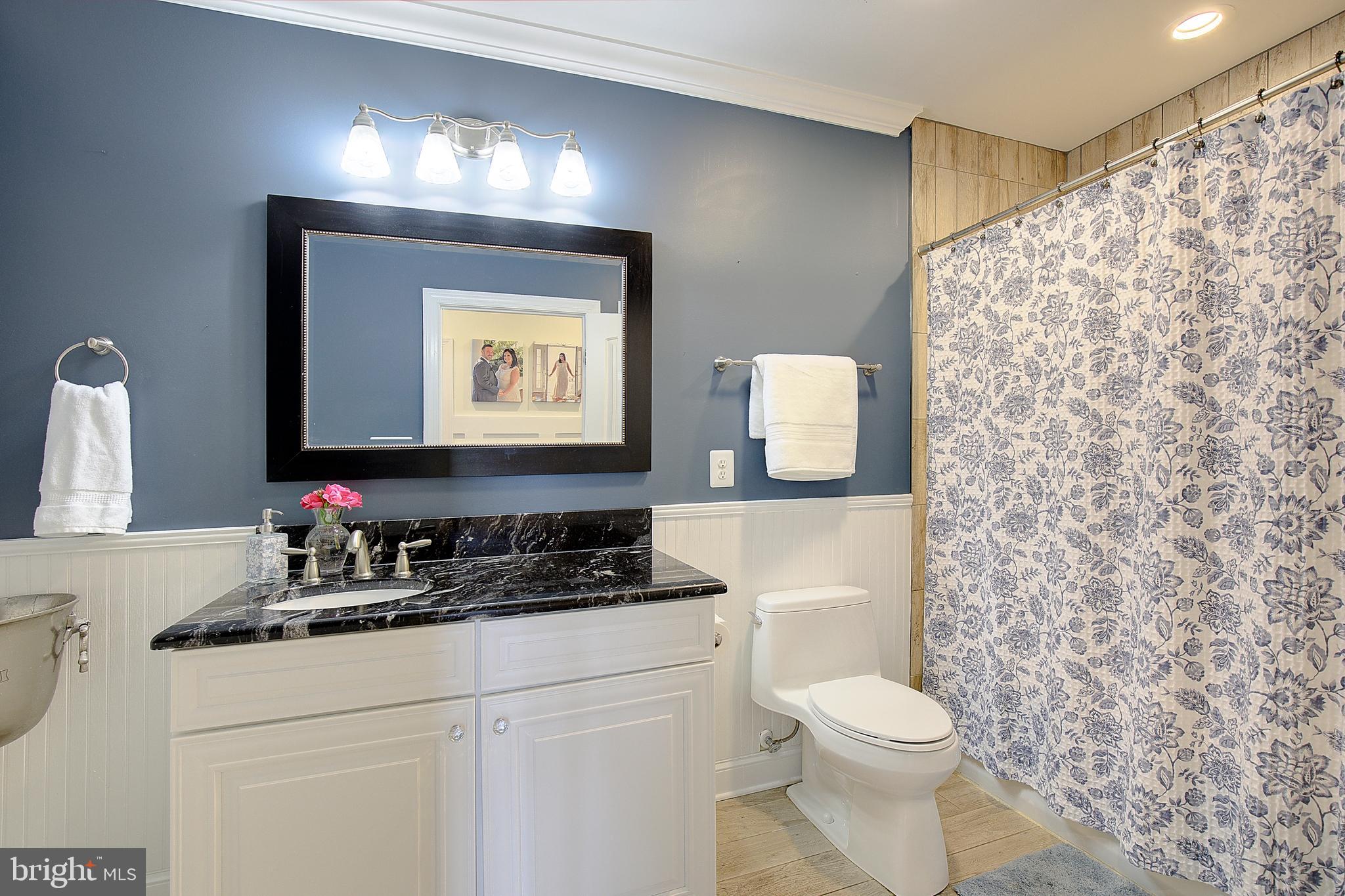 2393 Garrity Road St. Leonard, MD 20685 - Photo 35 of 76 Main-level full bath near laundry & garage entry.