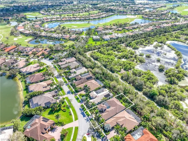 a view of a patio with a table and chairs