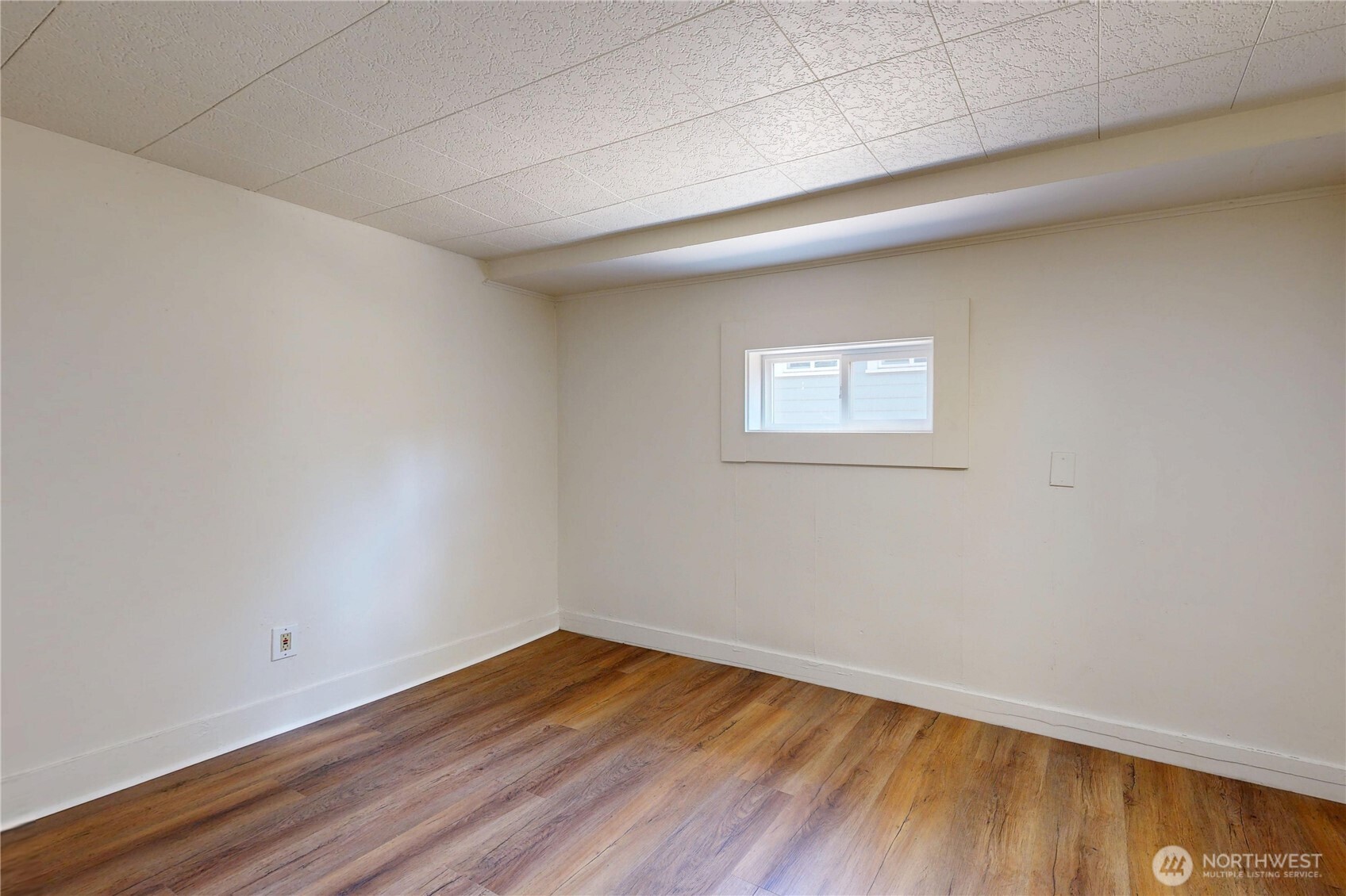 611 Southwest 3rd Street Pendleton, OR 97801 - Photo 13 of 21 a view of a room with wooden floor and window