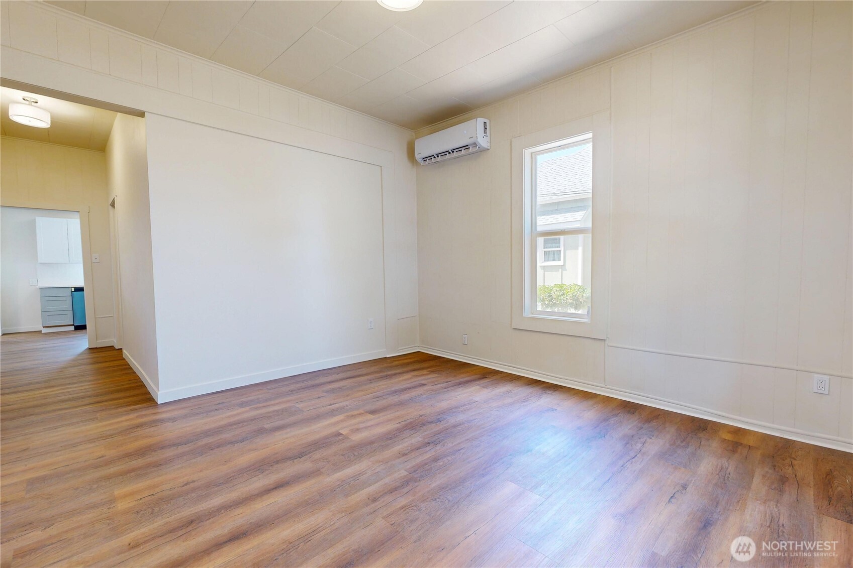 611 Southwest 3rd Street Pendleton, OR 97801 - Photo 2 of 21 a view of an empty room with wooden floor and a window